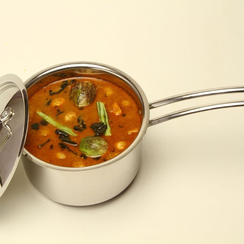 A stainless steel pot with a copper-toned base. Illustrative stock photograph, not a photograph of the reviewed pan.