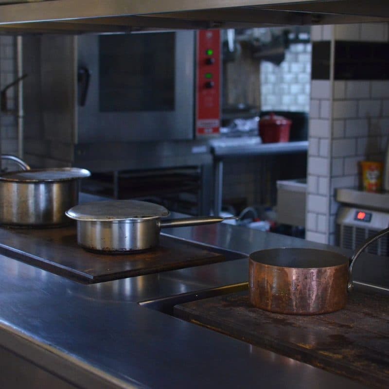 A large steel pot in a commercial kitchen. Illustrative stock photograph, not a photograph of the reviewed pot.