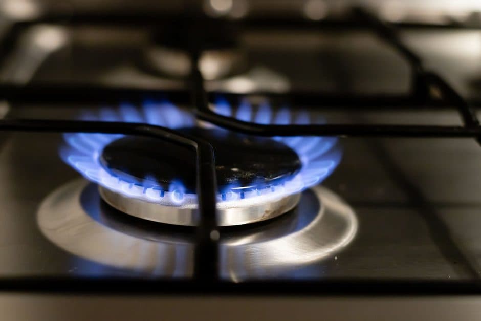 A pan heating on a stovetop.