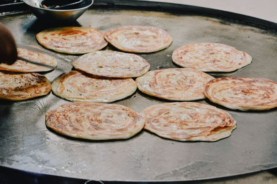 Water droplets on a hot cooking surface.